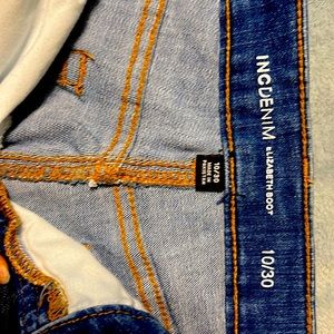 INC Elizabeth bootcut jeans with fringe hem.